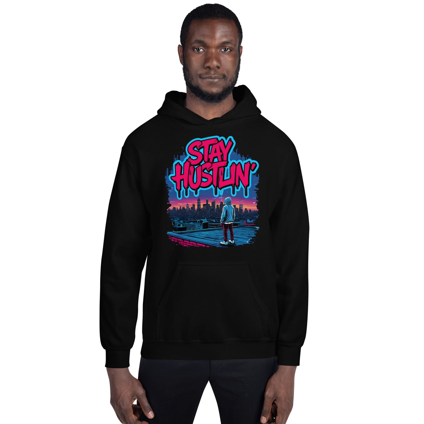 Close-up of Stay Hustlin’ hoodie print featuring bold pink graffiti text and detailed skyline artwork.