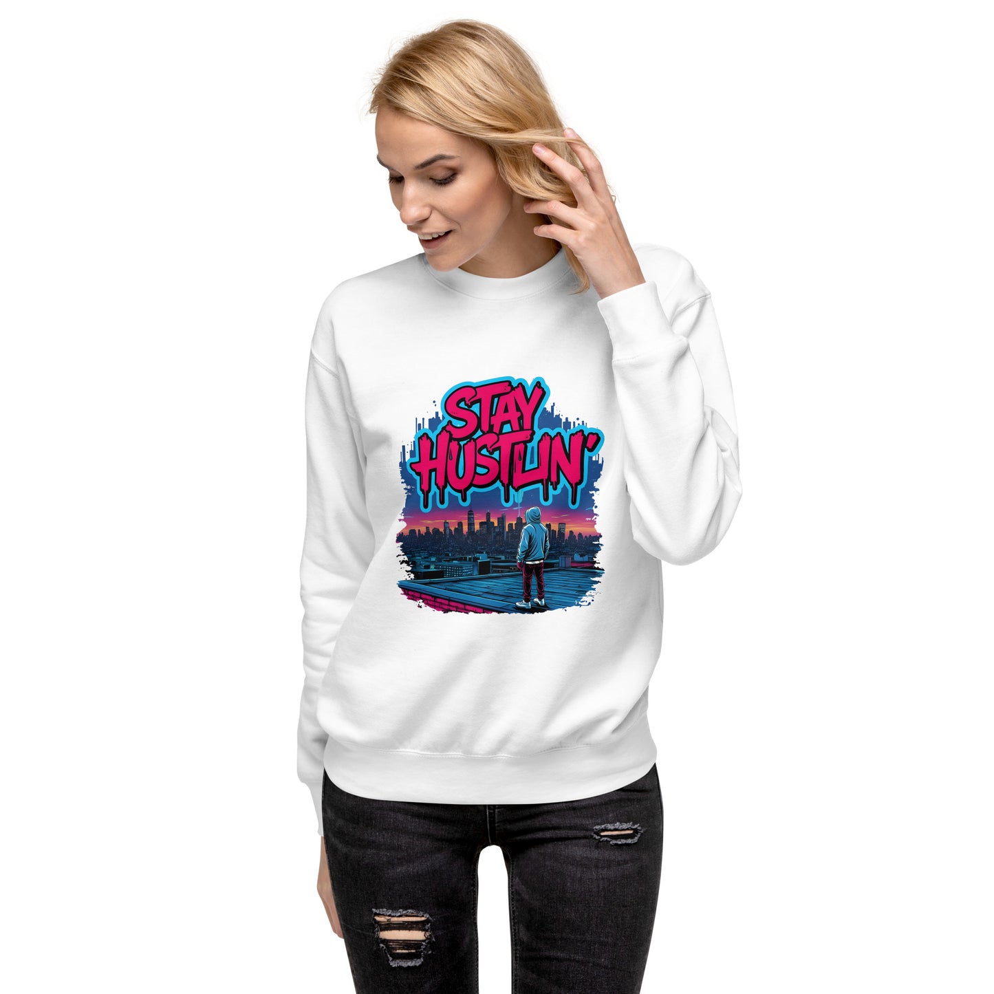 Model wearing Stay Hustlin’ unisex sweatshirt in a city setting, showcasing streetwear style.”