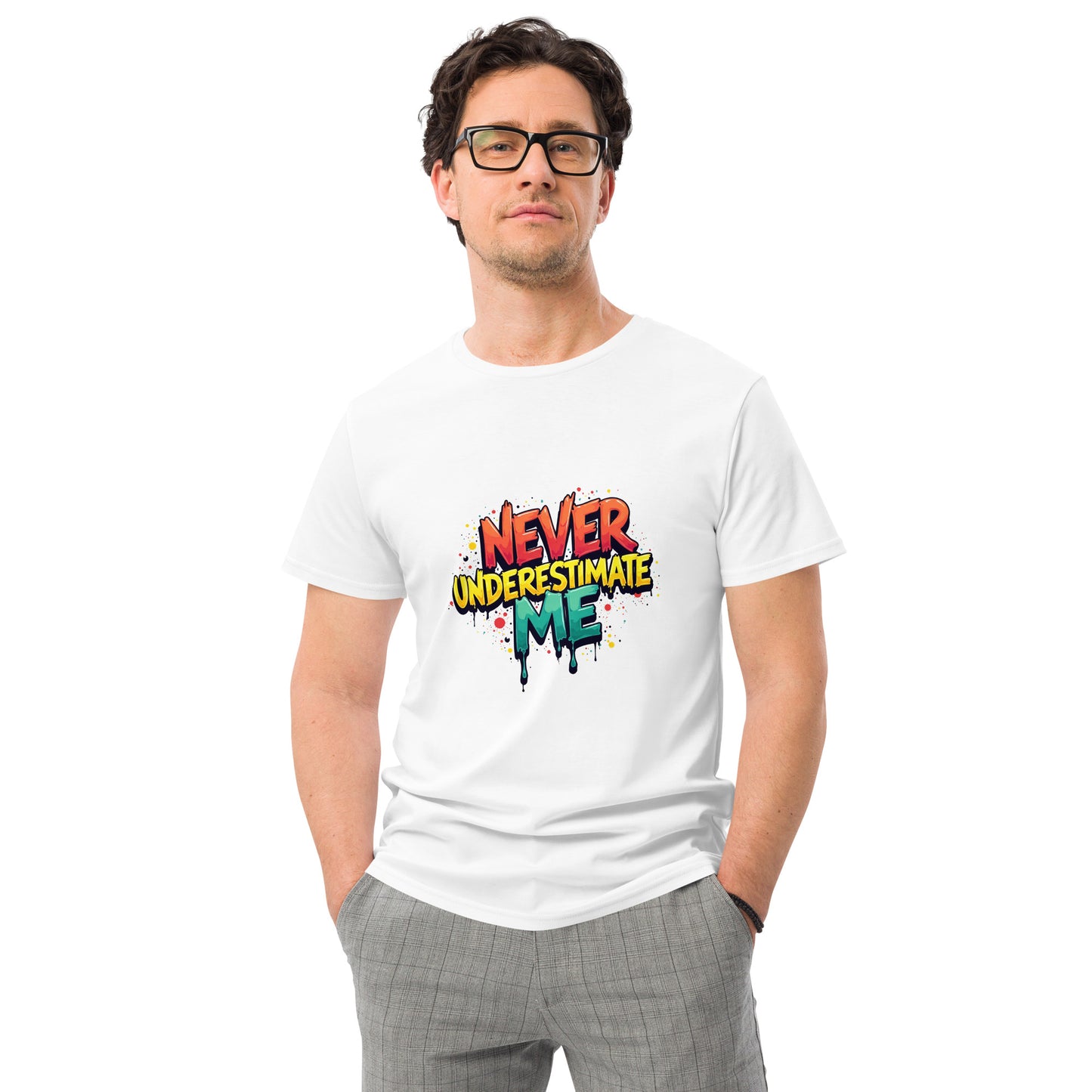 Never Underestimate Me t-shirt design with bold graffiti-style lettering in red, yellow, and teal splatter effect.