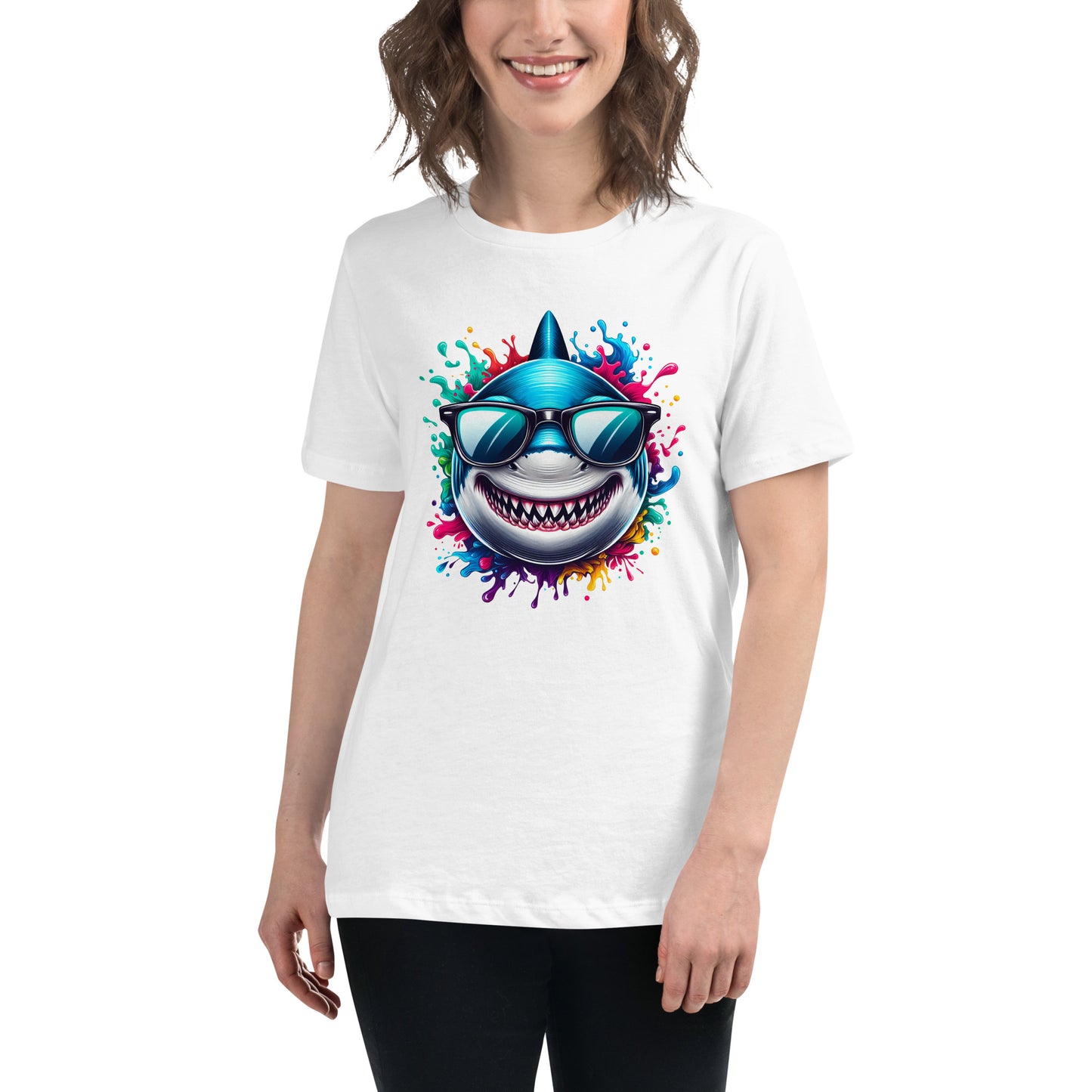 Grinning cartoon shark with sunglasses bursting through rainbow-coloured splash design on a white t-shirt.