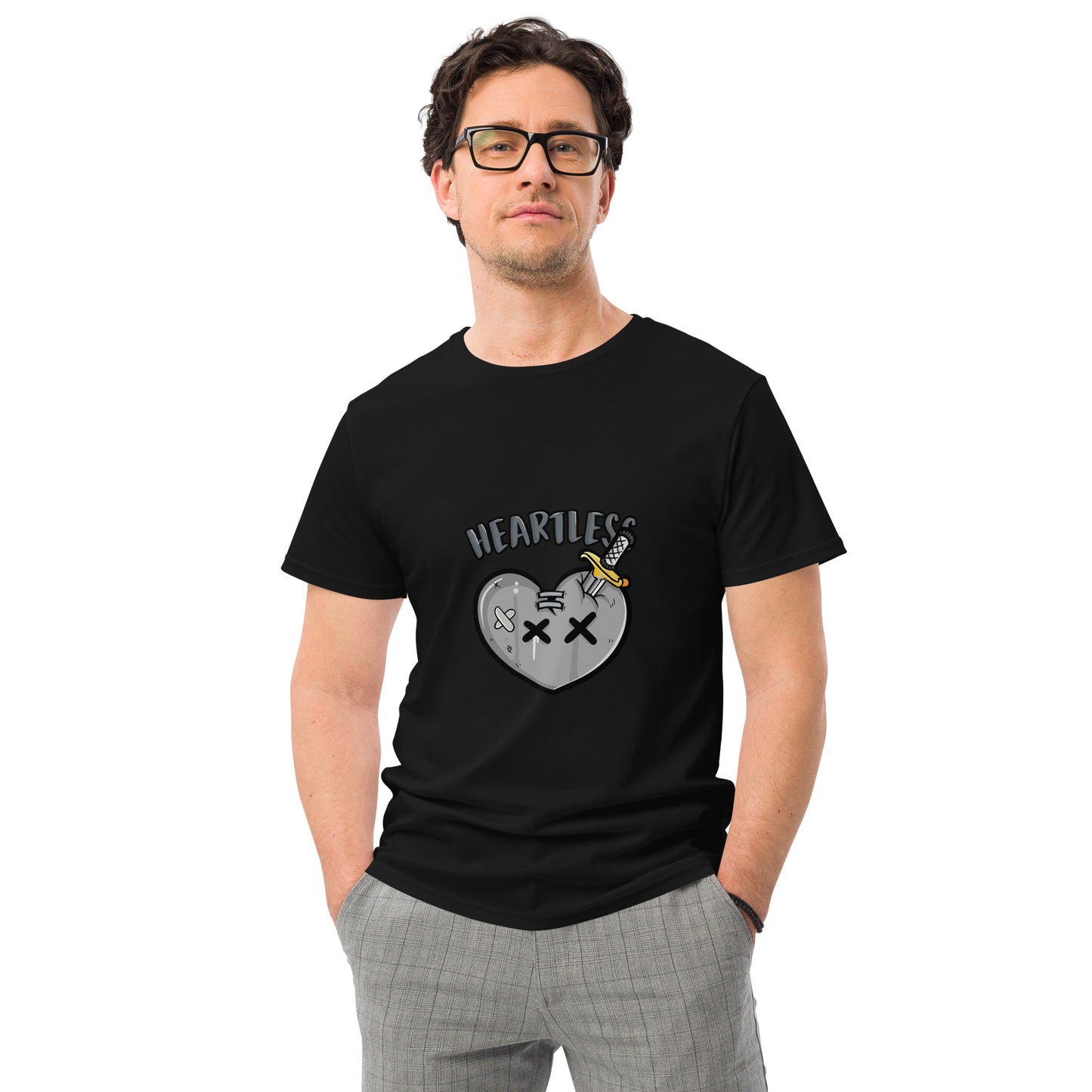 Heartless streetwear T shirt with a broken heart cartoon graphic, dagger artwork and bold lettering, printed with high quality DTF printing in the UK.

