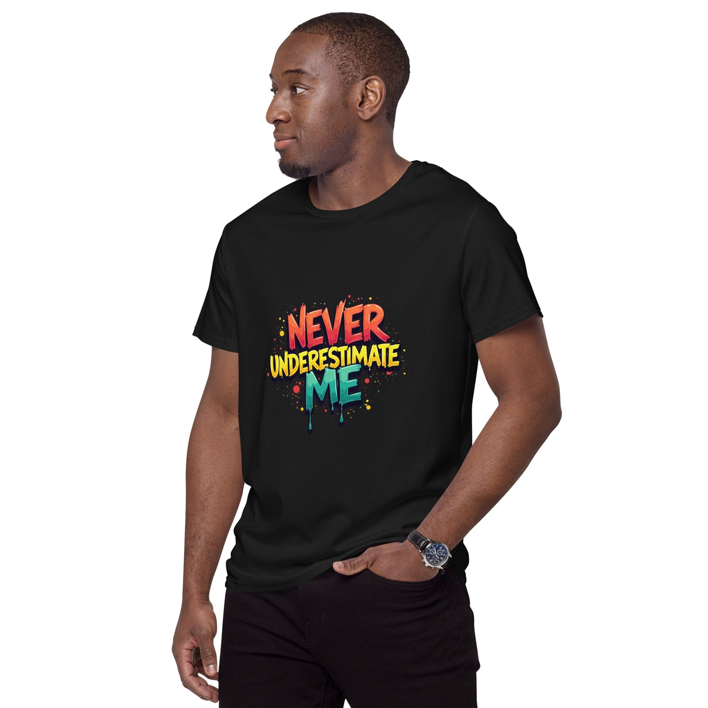 Never Underestimate Me t-shirt design with bold graffiti-style lettering in red, yellow, and teal splatter effect.

